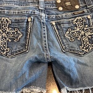 Miss Me Blue Denim Embroidered Cross Pocket Cutoff Shorts